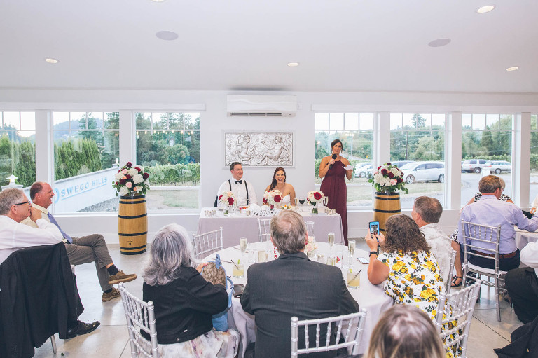 wedding toasts at oswego hills winery indoor reception in oregon