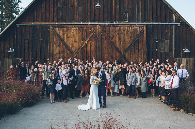 large  group photo of wedding guests at tin roof barn